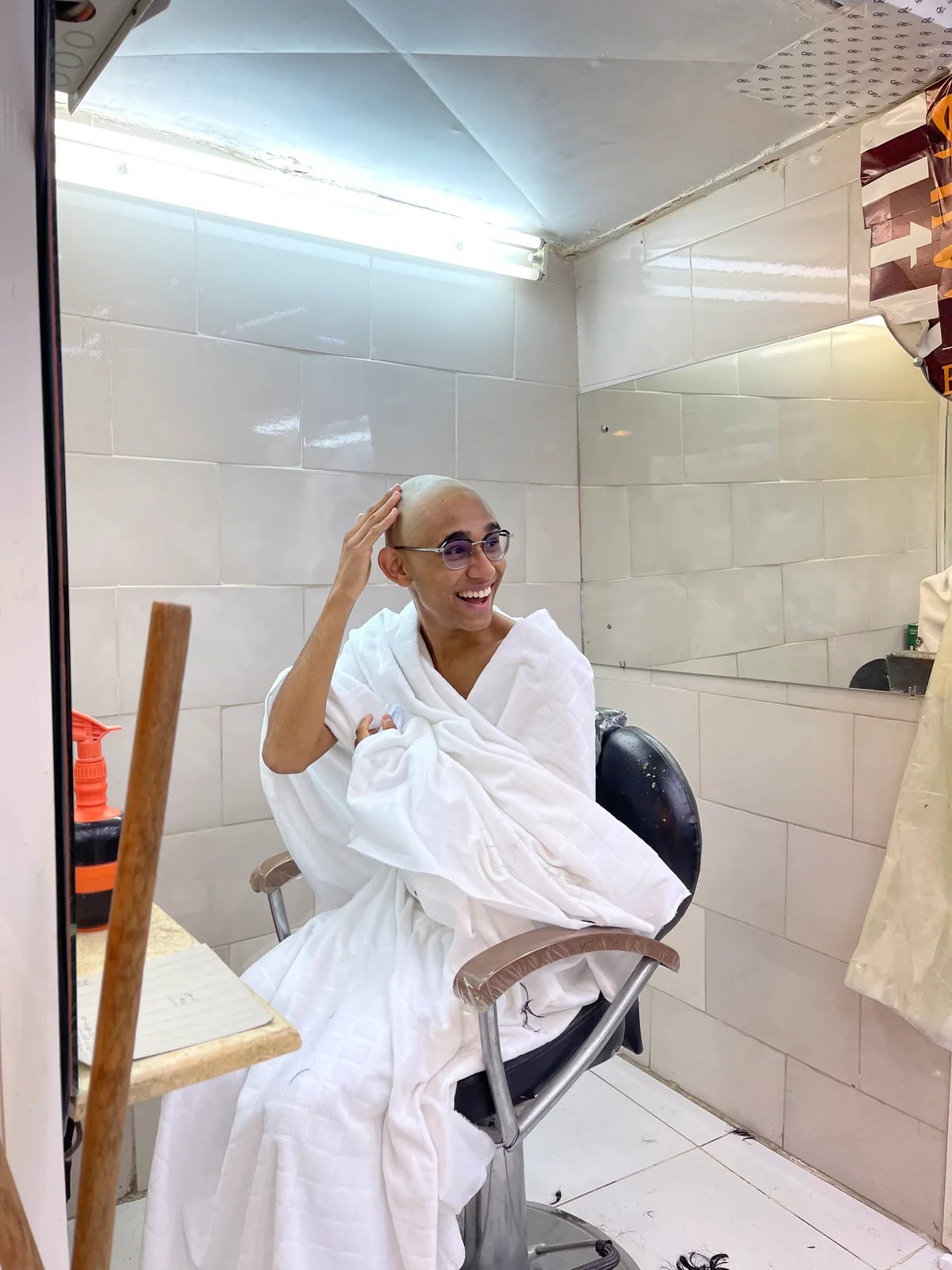 Nabeel Thotti in a barber chair in Saudi Arabia